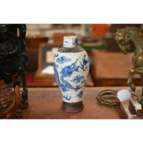 406 - A Chinese blue and white vase painted with dragons on a crackle glaze with incised biscuit bands,27 ... 