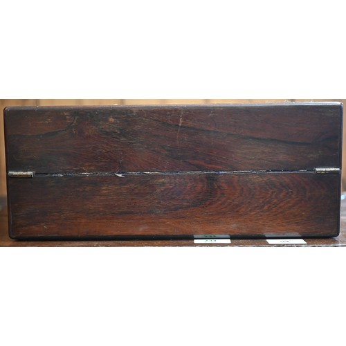 449 - A Victorian rosewood writing slope with blue velvet-lined fitted interior, inlaid overall with brass... 