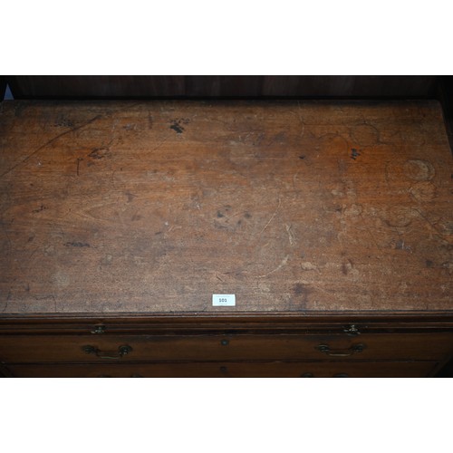 101 - A George III mahogany chest of three long graduating drawers below brush slide, raised on shaped bra... 