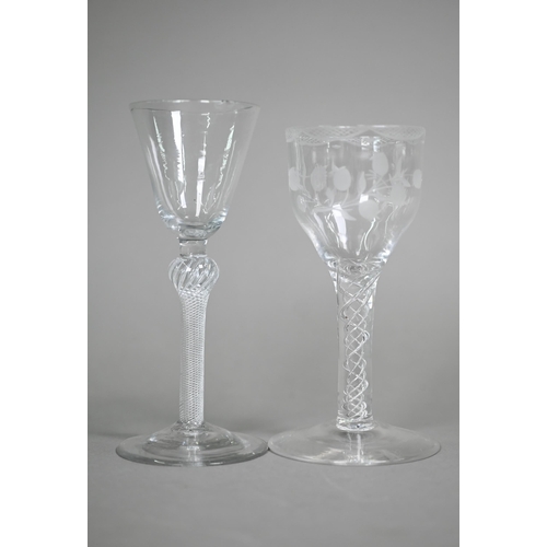 12 - A cordial glass with round funnel bowl on air twist baluster stem and conical foot, 16 cm, to/w a wi... 