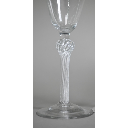 12 - A cordial glass with round funnel bowl on air twist baluster stem and conical foot, 16 cm, to/w a wi... 