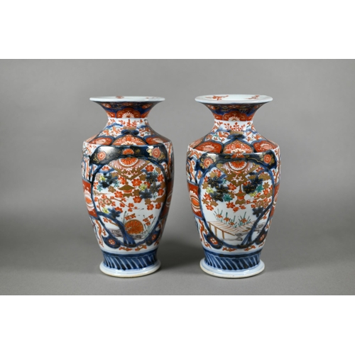 63 - A pair of 19th century Japanese Imari vases, Meiji period (1868-1912) painted with phoenix, landscap... 