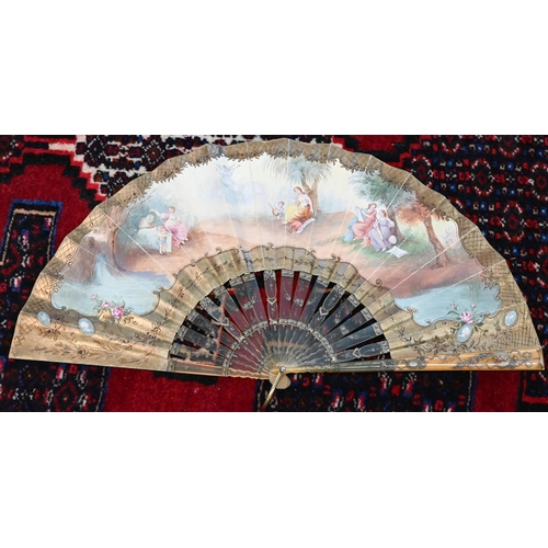 115 - An antique fan, the paper leaf painted in watercolour with Muses, on painted tortoiseshell (probably... 