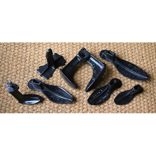 136 - A cobbler's three-way shoe last and a graduated set of four lasts on interchangeable stand