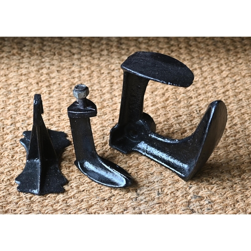 136 - A cobbler's three-way shoe last and a graduated set of four lasts on interchangeable stand