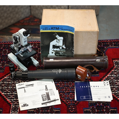 137 - A Japanese ATM-12 microscope by Meiji, no. 250075, in plywood box with accessories and manuals, to/w... 