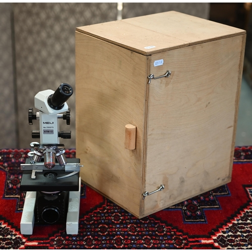 137 - A Japanese ATM-12 microscope by Meiji, no. 250075, in plywood box with accessories and manuals, to/w... 