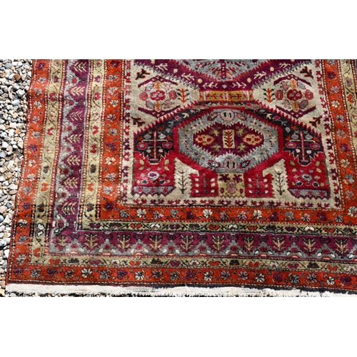 239 - An old Caucasian Shirvan rug, the diamond lozenge pole design on red-brown ground, 200 cm x 130 cm20... 