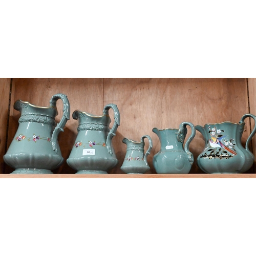 30 - Three Victorian Ridgway green-glazed jugs in differing sizes, with moulded decoration and floral pri... 