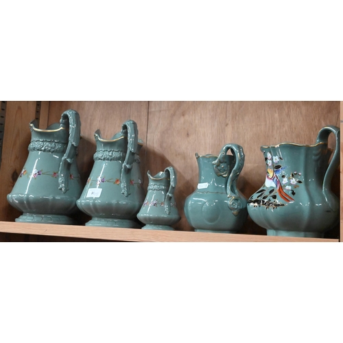 30 - Three Victorian Ridgway green-glazed jugs in differing sizes, with moulded decoration and floral pri... 