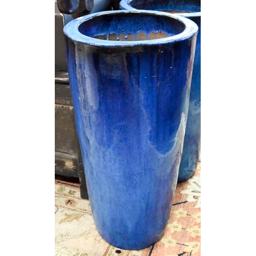 34 - Three large blue-glazed pottery garden planters, 69 cm high (3)