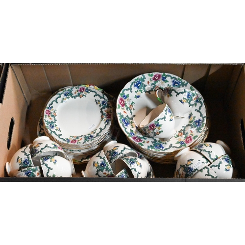 39 - # An Art Deco Royal Doulton pottery part dinner service with blue banded rims, to/w a Royal Cauldon ... 