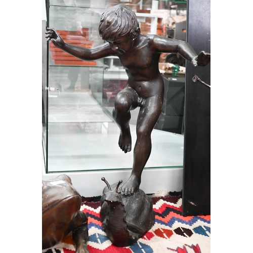 399 - After Giovanni Cappelletti - A bronzed statue or water feature of a boy on a snail, 68 cm high to/w ... 