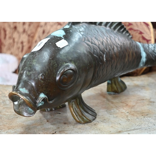 414 - A large patinated bronze Koi Carp, 60 cm wide