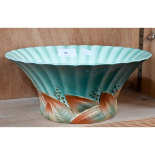 48 - A Royal Worcester Art Deco bowl with flared and fluted rim and moulded gilt foliate foot, date mark ... 