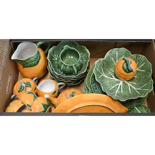 49 - A quantity of continental Majolica and other novelty tableware modelled as fruit and vegetables, to/... 