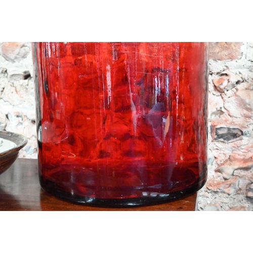 65 - A red glass cylindrical carboy, 45 cm high