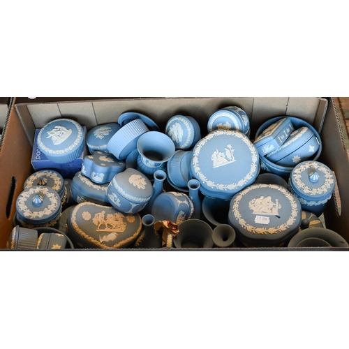 67 - A collection of over sixty Wedgwood pale blue Jasper ware ornaments including boxes, vases, jugs, et... 