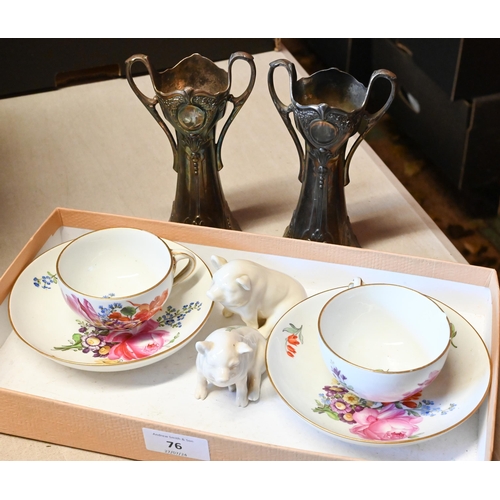 76 - A pair of Meissen floral-painted cups and saucers (one cup with chipped rim), to/w two Belleek pigs ... 