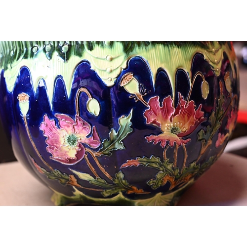 79 - A late 19th century German Majolica jardiniere decorated with poppies on a blue ground, Josef Strnac... 