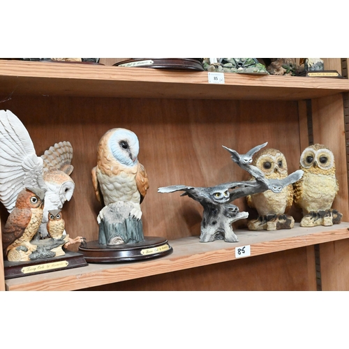 85 - Fourteen various resin owl ornaments