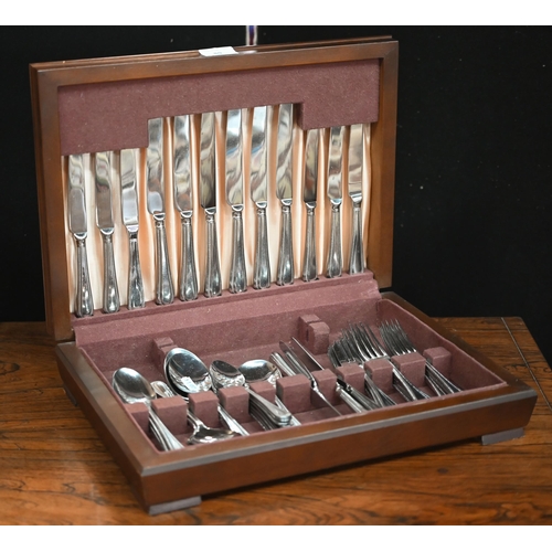 89 - A canteen of stainless steel bead-edge flatware and cutlery