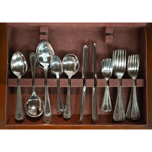 89 - A canteen of stainless steel bead-edge flatware and cutlery