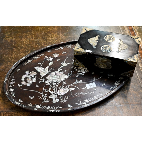 98 - A Chinese oval rosewood tray richly inlaid with mother of pearl flowers, birds and insects, 54 x 34.... 