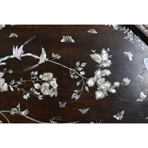 98 - A Chinese oval rosewood tray richly inlaid with mother of pearl flowers, birds and insects, 54 x 34.... 