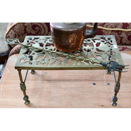 390 - # An antique brass rectangular trivet, brass toasting fork and a small copper kettle (3)