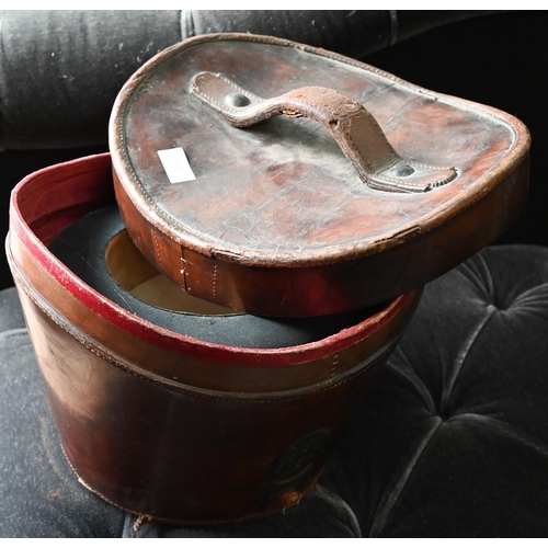 400 - An antique silk top hat by Tress & Co. in a leather travel case to/with a pair of vintage riding... 