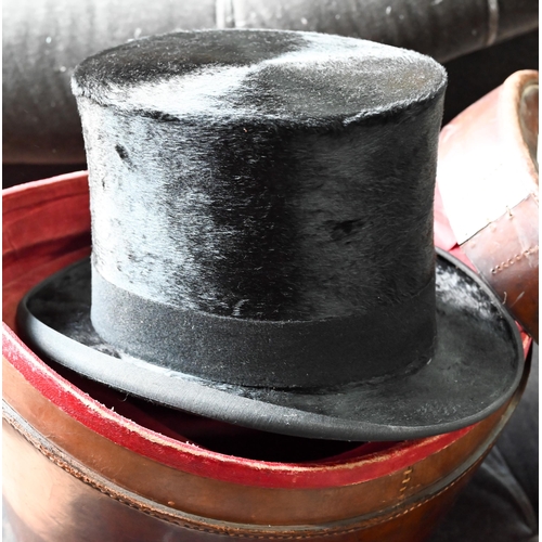 400 - An antique silk top hat by Tress & Co. in a leather travel case to/with a pair of vintage riding... 