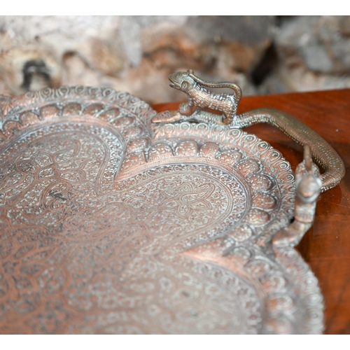 415 - An early 20th century Indian embossed and engraved copper tray with snake and lion handles, 67 cm x ... 