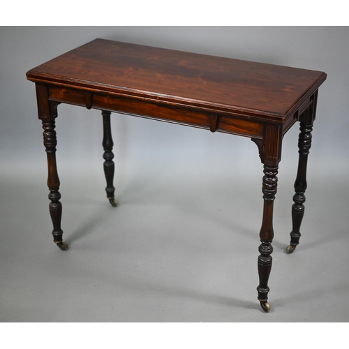 70 - G. Trollope & Sons, London, a rosewood card table, the rectangular fold over top enclosing a gre... 