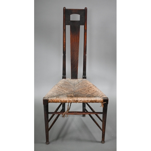 180 - An Arts & Crafts Glasgow School oak high back chair with rush seat, probably by John Ednie (1876... 