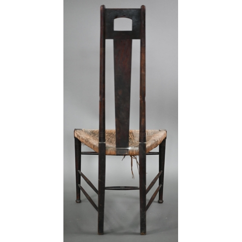 180 - An Arts & Crafts Glasgow School oak high back chair with rush seat, probably by John Ednie (1876... 