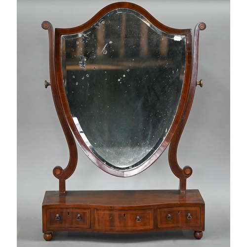 106 - A 19th boxwood inlaid mahogany shield shaped toilet mirror, raised on a serpentine base with three d... 