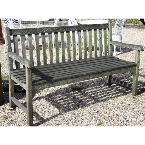 10 - A weathered slatted teak three seater garden bench, 150 x 62 x 90 cm high