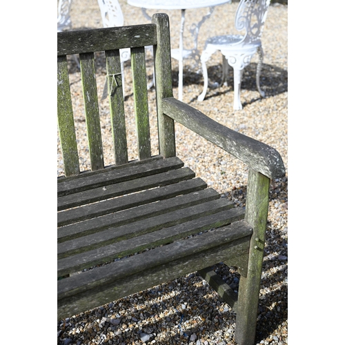 10 - A weathered slatted teak three seater garden bench, 150 x 62 x 90 cm high