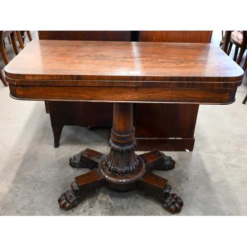 108 - A Regency rosewood card table with rotating folding baize lined top on turned column and quadraform ... 