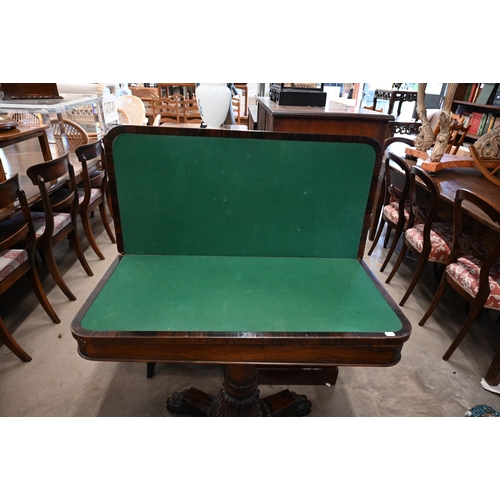 108 - A Regency rosewood card table with rotating folding baize lined top on turned column and quadraform ... 