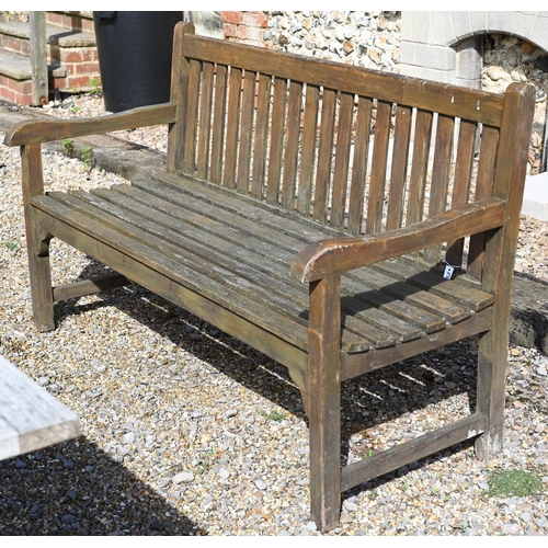 11 - A stained slatted teak three seater garden bench, 'Solid Wood Company' plaque, 150 x 62 x 90 cm high