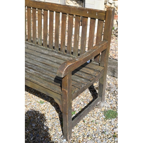 11 - A stained slatted teak three seater garden bench, 'Solid Wood Company' plaque, 150 x 62 x 90 cm high