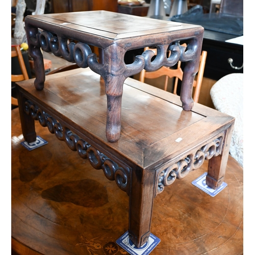 116 - A Chinese hardwood coffee table with fret-cut scroll frieze, 76 x 40 x 28 cm to/w a similar smaller ... 