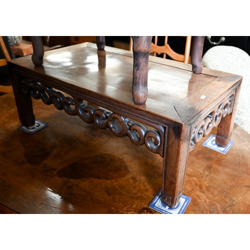 116 - A Chinese hardwood coffee table with fret-cut scroll frieze, 76 x 40 x 28 cm to/w a similar smaller ... 