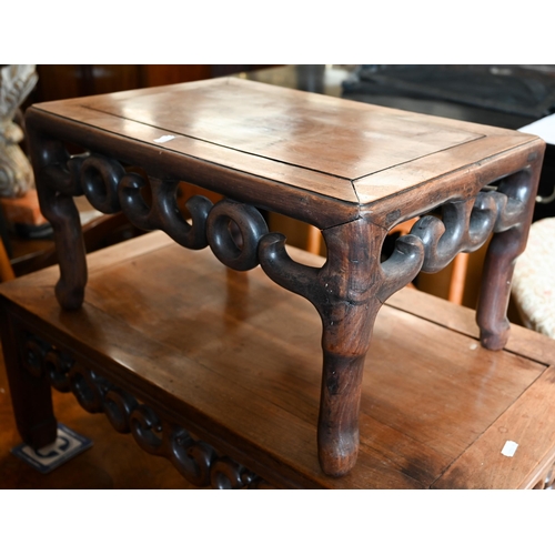 116 - A Chinese hardwood coffee table with fret-cut scroll frieze, 76 x 40 x 28 cm to/w a similar smaller ... 