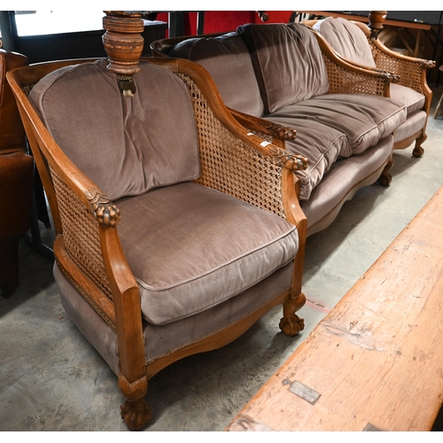 122 - An early 20th century Bergere lounge suite comprising settee, 125 x 80 x 80 cm and pair of armchairs... 