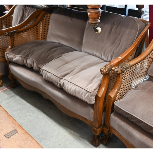 122 - An early 20th century Bergere lounge suite comprising settee, 125 x 80 x 80 cm and pair of armchairs... 