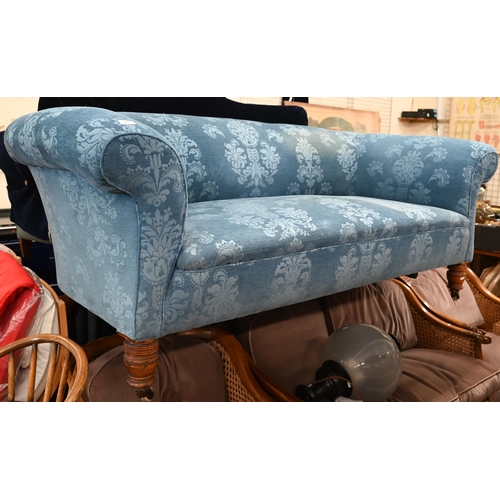 123 - An Edwardian traditional Chesterfield sofa in foliate pattern blue fabric with ring turned front leg... 