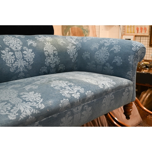 123 - An Edwardian traditional Chesterfield sofa in foliate pattern blue fabric with ring turned front leg... 